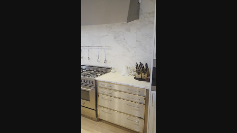 Pre-owned SieMatic kitchen cabinetry and marble countertops