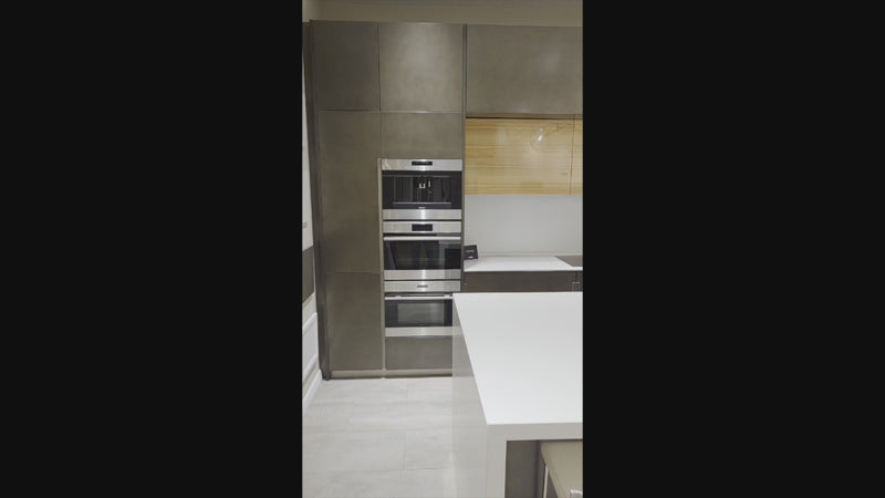 Composit Modern Brown Kitchen with Waterfall Island, Stone Countertops and Wolf & Sub-Zero Appliances