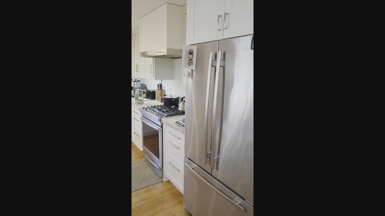 Load video: Cuiffo Cabinetry custom white transitional kitchen with island and JennAir range