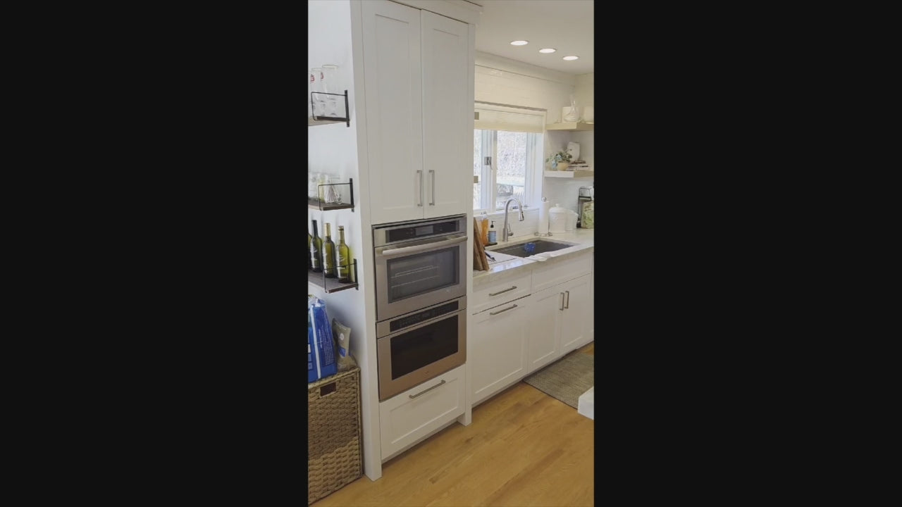 Load video: Luxury white kitchen suite by Cuiffo featuring professional JennAir appliances