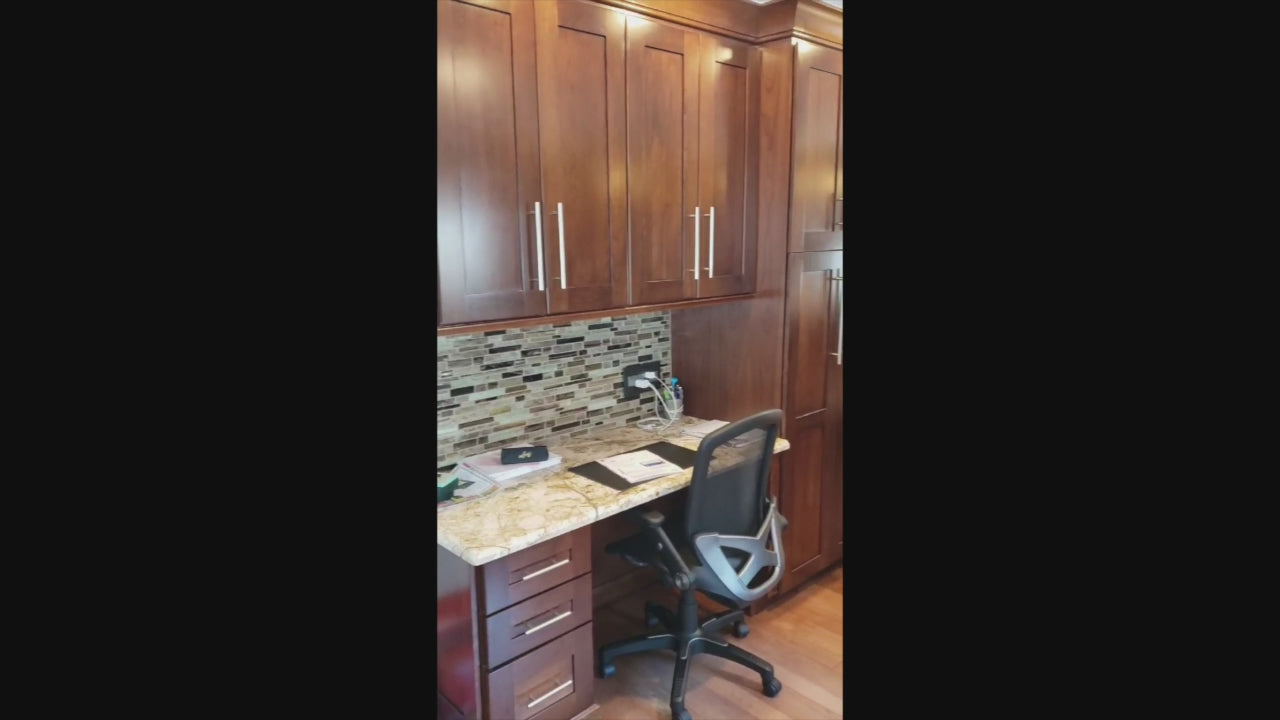 Load video: Kraftmaid Transitional Dark Wooden Kitchen with Marble Countertops and GE Monogram Appliances