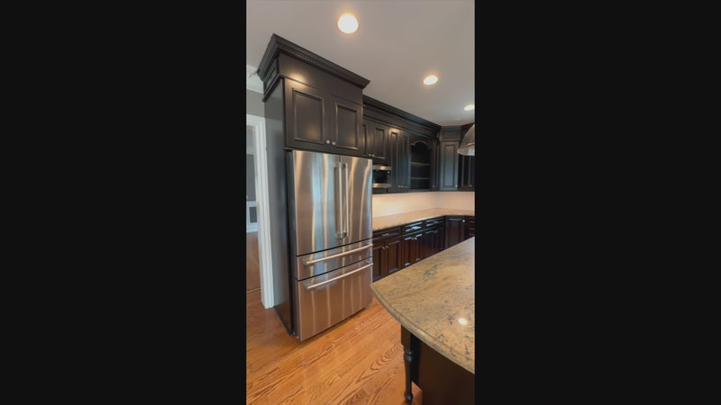 The Onyx transitional jet black kitchen suite with central island and appliances
