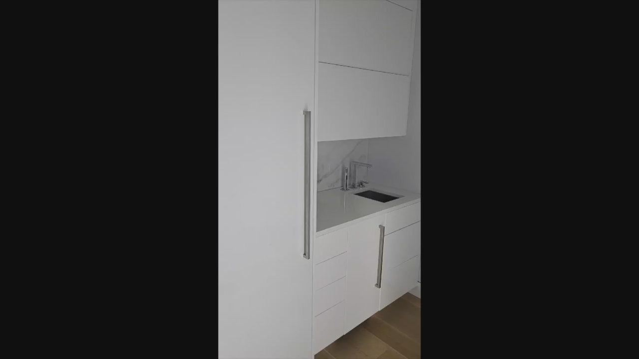 Load video: Brubaker Modern White Lacquered Butler's Pantry with Stone Countertops and Ice Maker