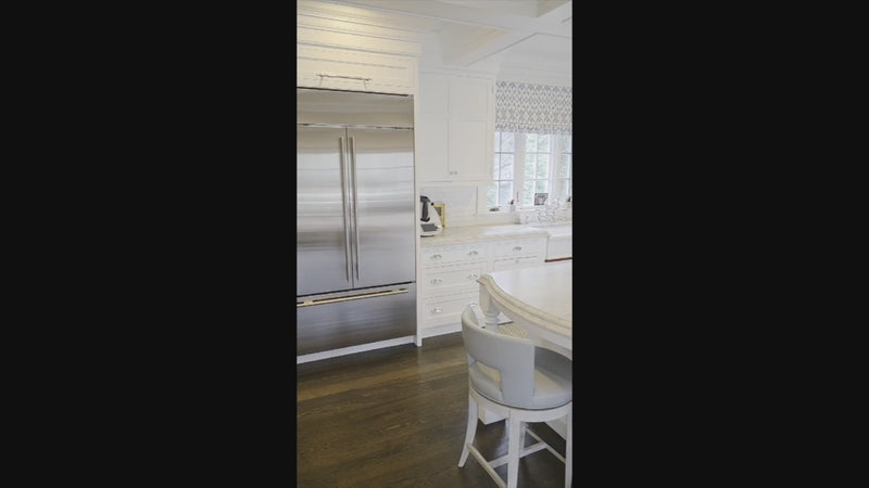 Premier custom-built white transitional kitchen with large island and full appliance package
