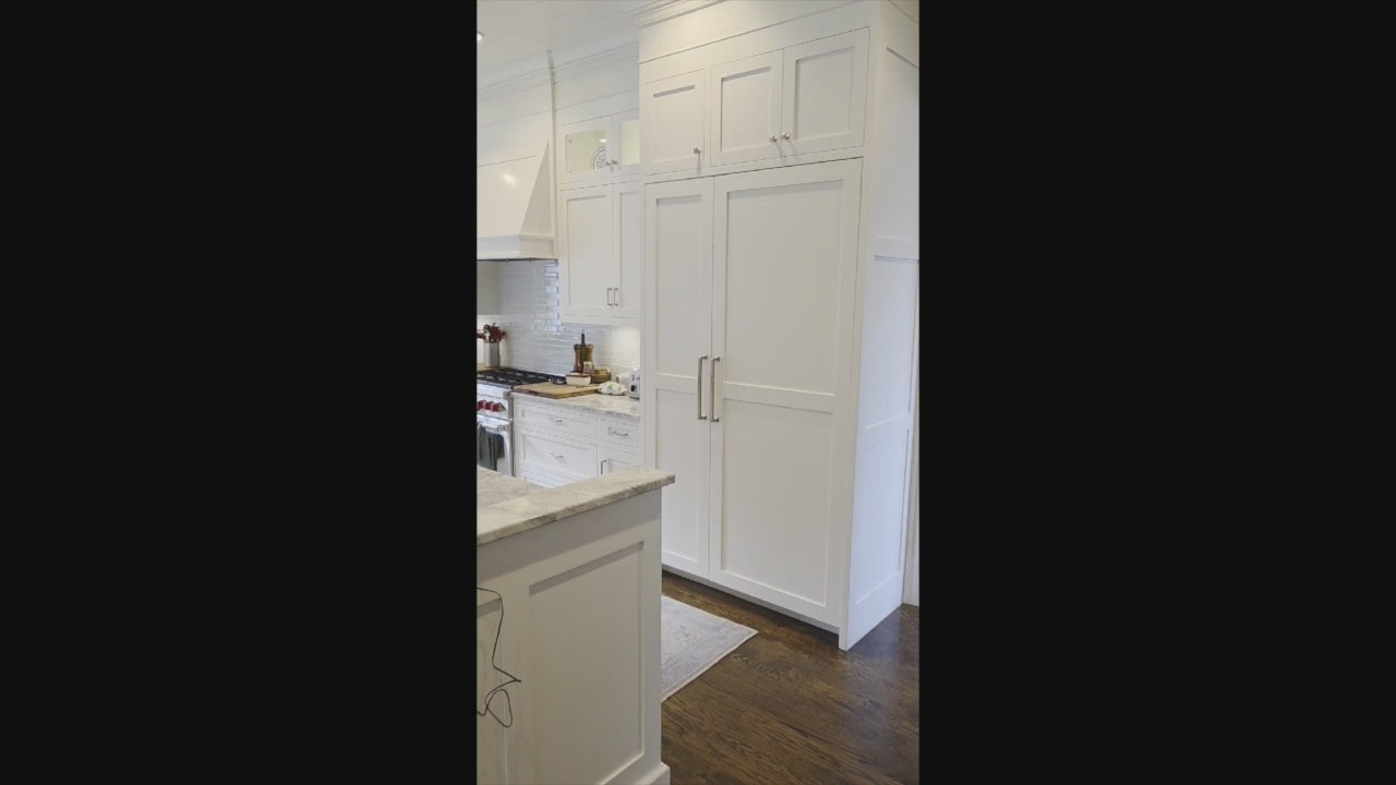 Load video: Custom Transitional White Kitchen with Island, Marble Countertop and Sub-Zero &amp; Wolf Appliances